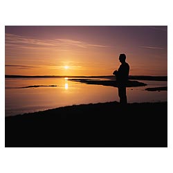 Loch of Harray - Scotland Tourist with camera watching sunset at Lochside nature reserve uk  photo 