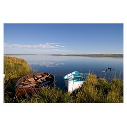 Loch of Harray - Fishing boats beach on grassy shore rowing boat quiet scotland  photo 