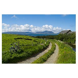 Bay of Ireland - Bicycle at side of farm track Burn of Ireland mill stream  photo 