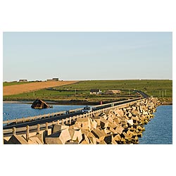 Churchill Barrier - Car on road crossing third Churchill Causeway defenses  photo 