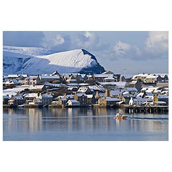 Scottish Harbour - Town fishingboat leaving harbour winter snow scene boat harbor scotland uk  photo 