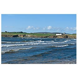 Scapa Whisky Distillery - Seawaves and Scapa Whisky distillery on seacliffs scotland  photo 