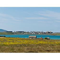 Flotta Oil Terminal - Cottage croft and oil tanks scotland  photo 