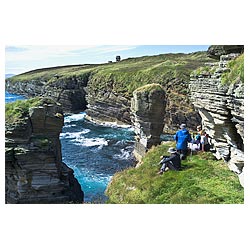 Stanger Head - Hikers on sea cliff path Cletts stone stacks hiking scotland  photo 