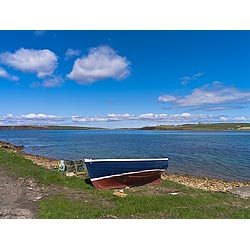 Widewall bay - Boat beached along shore line coast south ronaldsay scotland  photo 