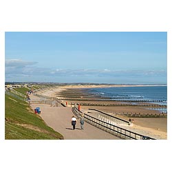 Seafront - People walking along promenade couple uk  photo 